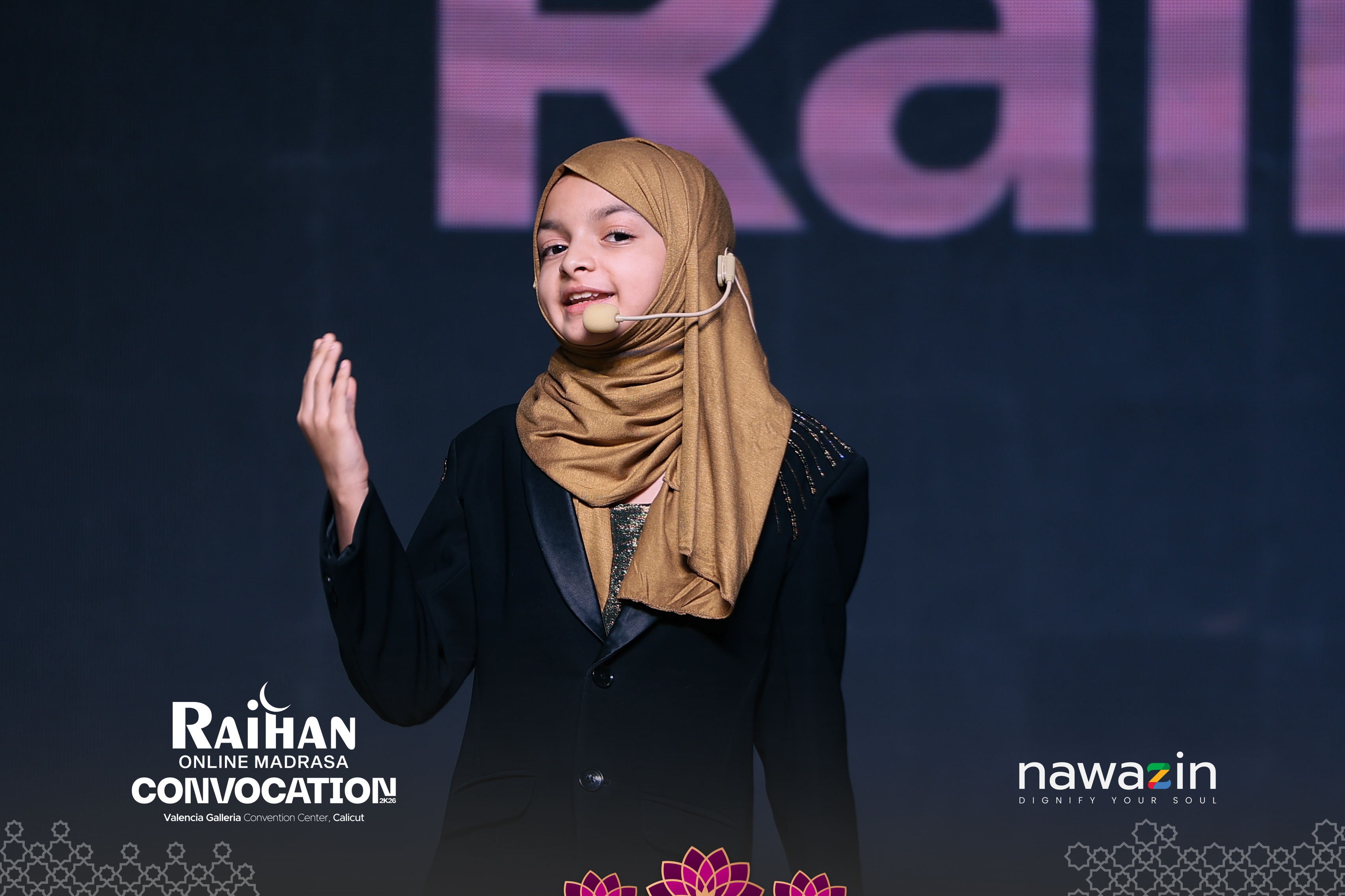 Student speaking on stage at the Raihan Online Madrasa Convocation 2K26